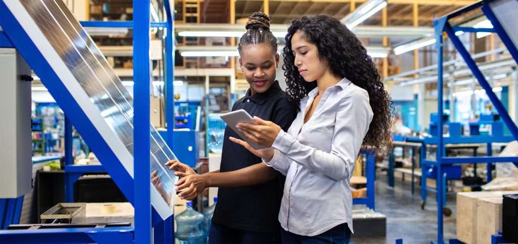 Manufacturing team collaborating in workshop